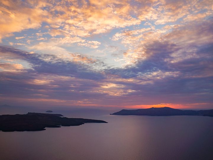 The sun setting over the caldera in Santorini