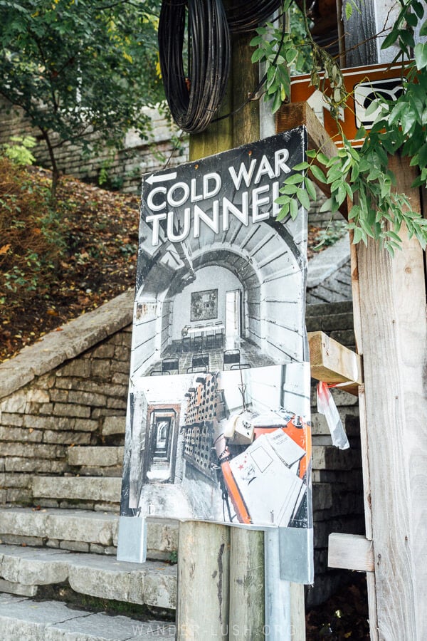 A sign points tourists to the Cold War Tunnel in Gjirokaster, Albania.