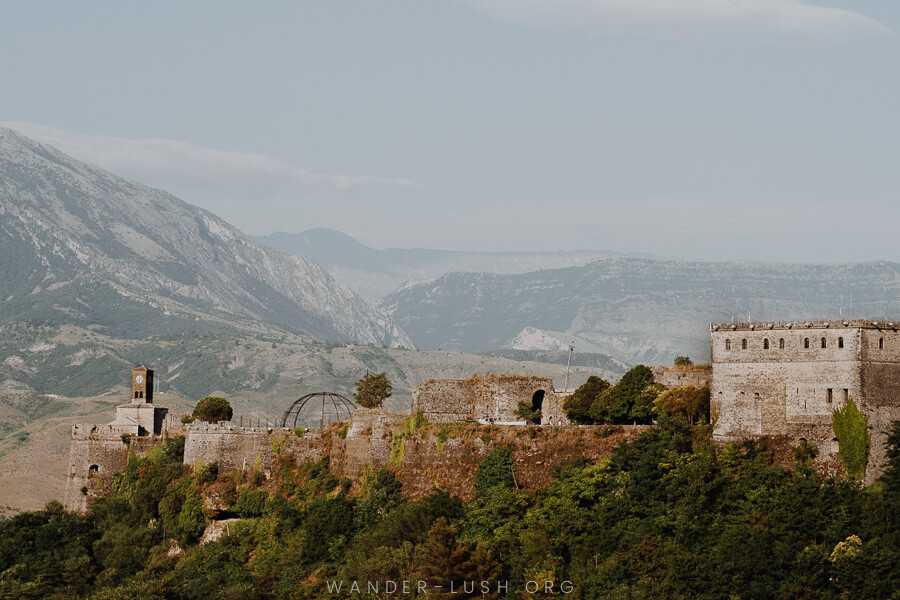 A stone castle atop a mountain.