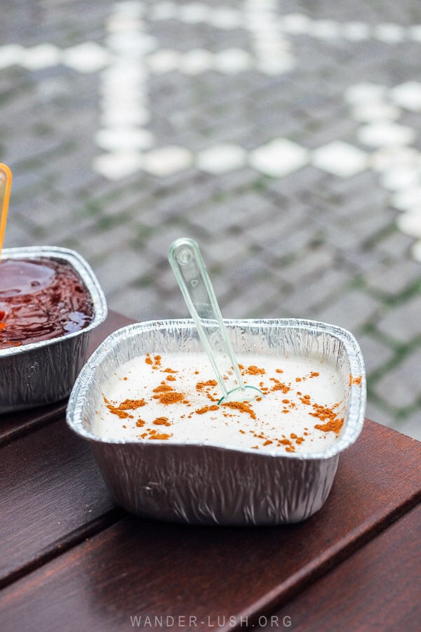 Oshaf, a traditional dessert in Gjirokaster Albania, a creamy pudding with a design of cinnamon sprinkled on top.