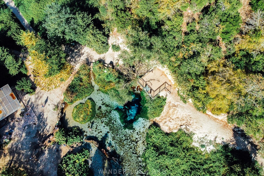 Aerial view of the Blue Eye in Albania, a natural wonder of crystal waters.