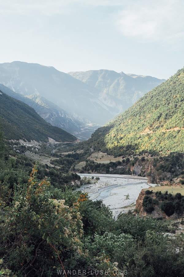 View of a river in Albania framed by moutains.