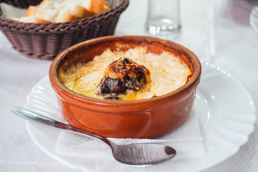 A clay pot dish of lamb and yogurt at a restaurant in Albania.