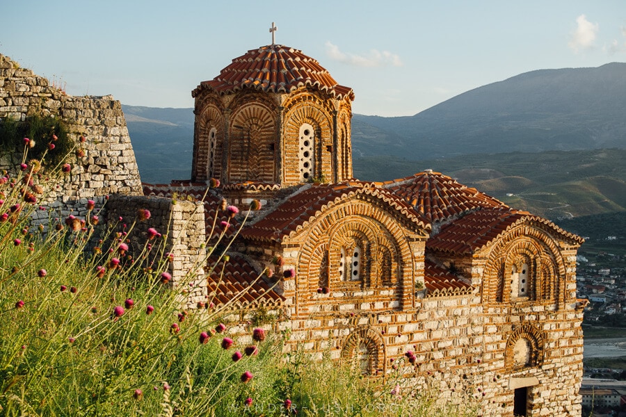 The Church of St Trinity bathed in golden light, one of the best things to do in Berat.