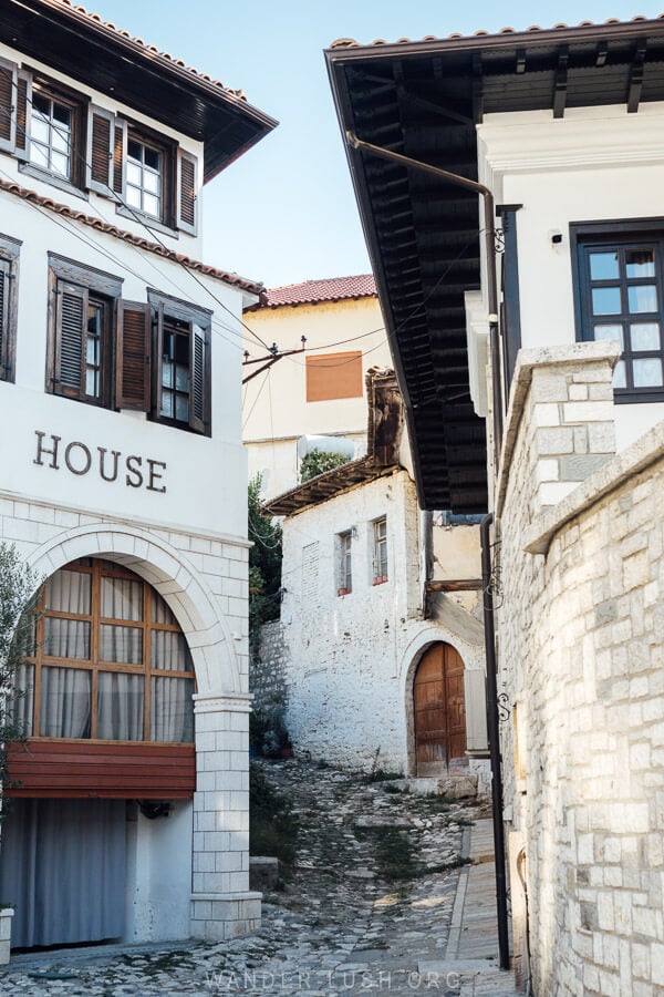 Houses in Mangalem Quarter in Berat, constructed in the Ottoman style with white walls and overhanging roofs.