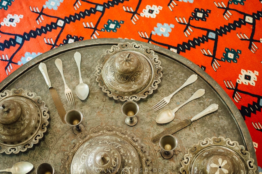 Silverware set against an Ottoman-style carpet.