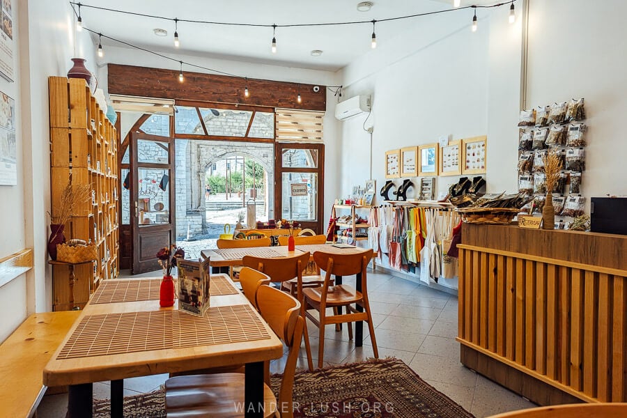 A trendy souvenir shop in Berat, Albania with a small cafe inside.