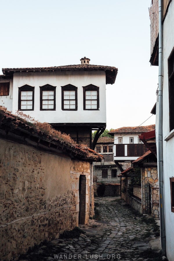 Ottoman houses in Kastoria arranged along a narrow cobbled street.