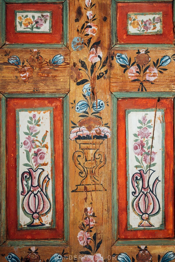 Painted flowers and fruits on a wall inside Tsiatsiapas Mansion.