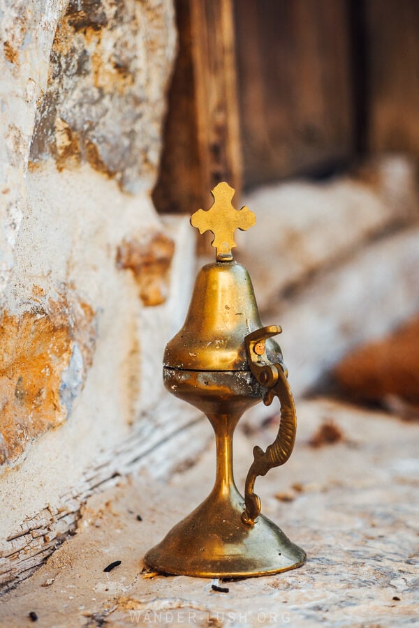 A small religious object sitting outside a church in Kastoria.