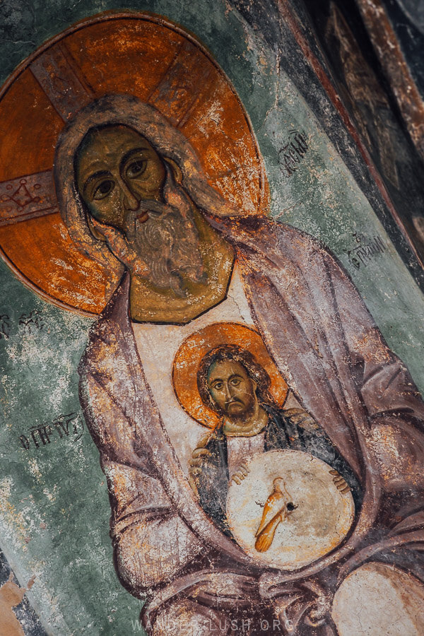 A rare depiction of the Holy Trinity on the ceiling of an ancient Byzantine church in Kastoria, Greece.