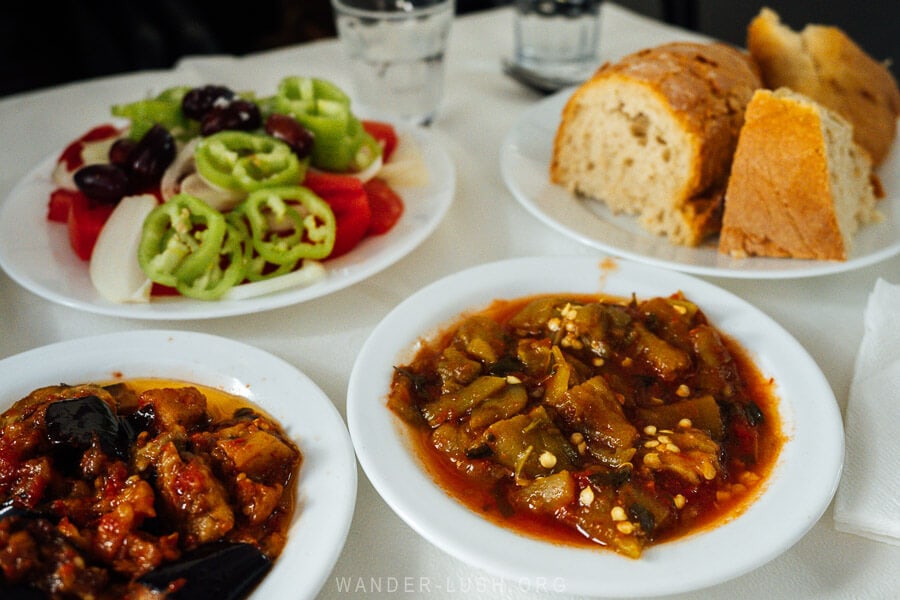 A local lunch of small plates of eggplant, peppers and bread at Cafe 108 in Kastoria.