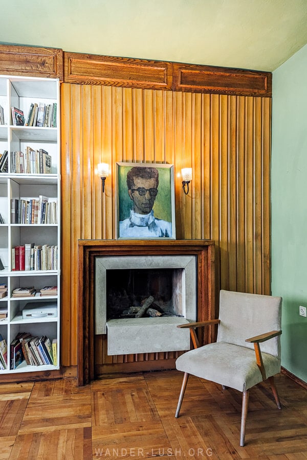 A portrait of Albanian author Ismail Kadare hanging above the fireplace at his former apartment in Tirana.
