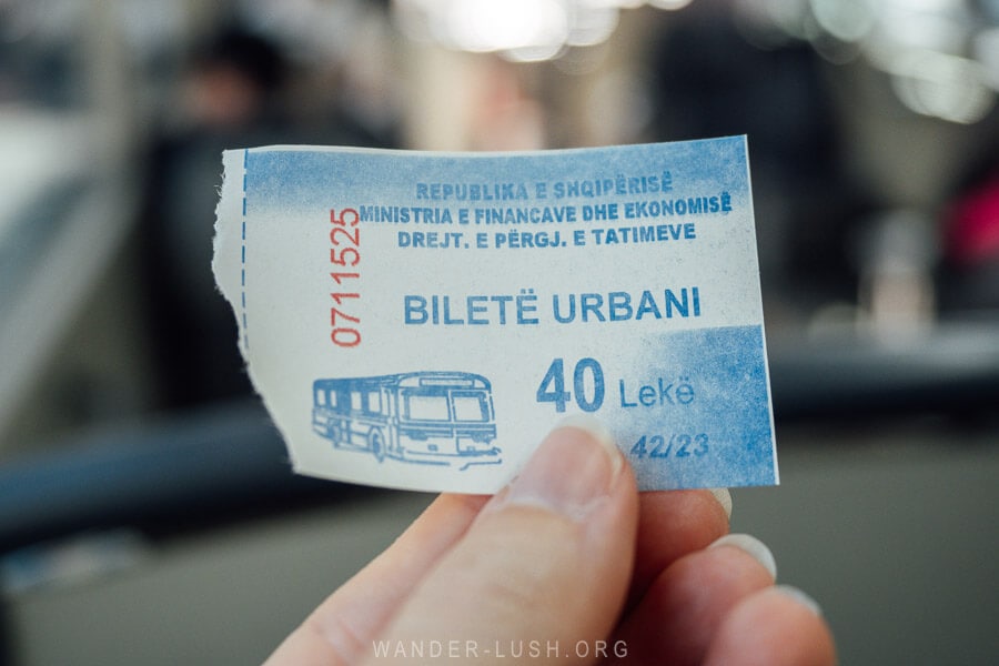 A blue Tirana bus ticket.
