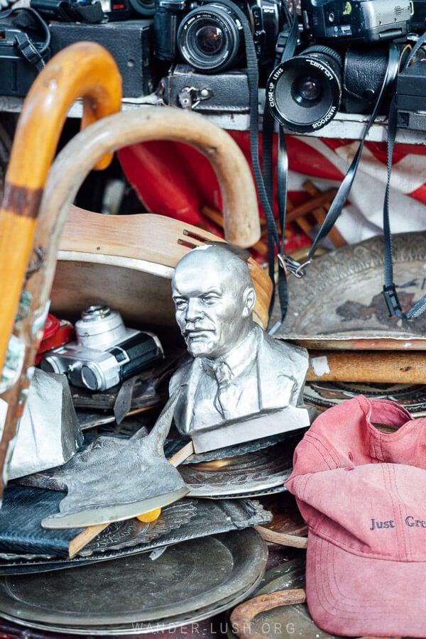 A jumble of antiques at a vintage shop in Tirana featuring an old bust of Lenin.