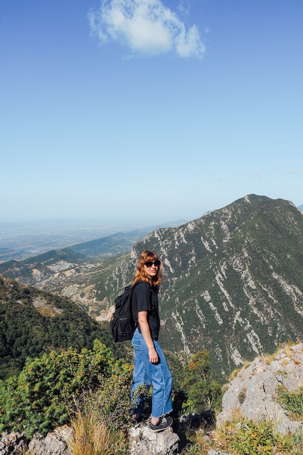 A woman looking out over the mountains from a viewpoint atop Tirana's Mount Dajti in Albania.