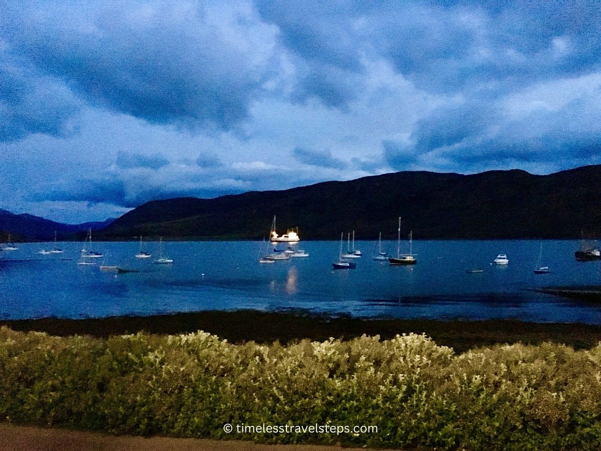 The scene is one of peaceful repose, as the boats appear to be resting, waiting for the next day's adventures on the waters of this beautiful Scottish Loch Broom, one of the best reasons that make Ullapool worth visiting