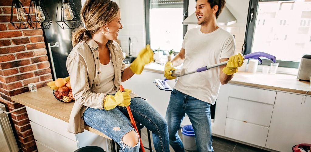 Couple cleaning house, doing house work