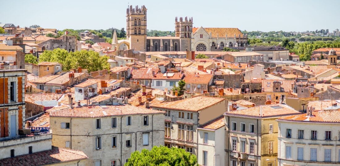 Aerial cityscape view on the old town with cathedral in Montpellier city during the sunny weather in Occitanie region if France. 