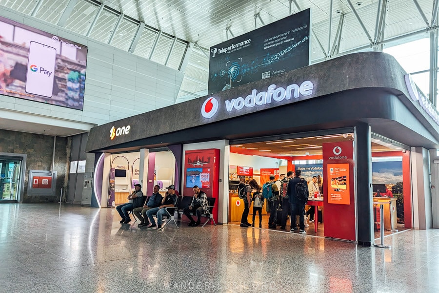 A Vodafone sim card shop inside the arrivals hall at Tirana Airport.