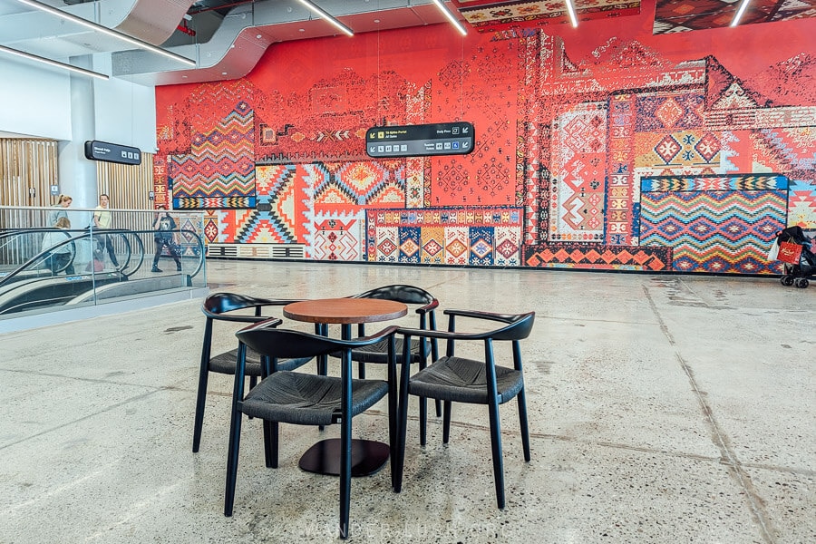 A cafe inside the Tirana Airport decorated with Albanian carpet designs.