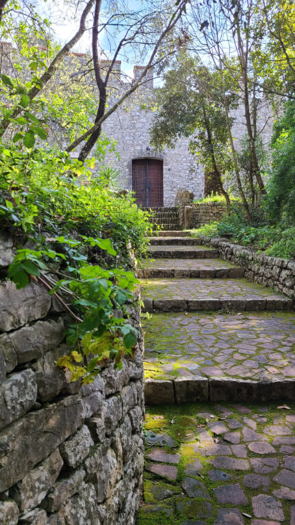 A path leads up to Butrint Castle in butrint archaeological park.