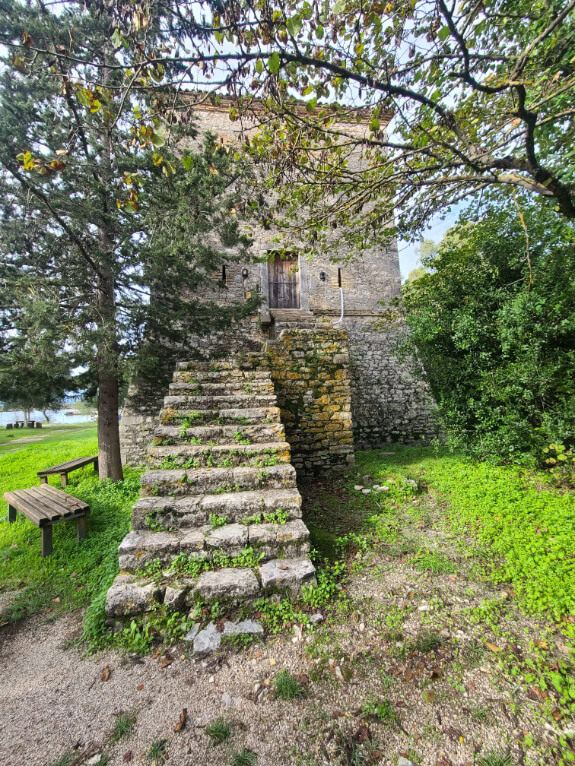 15th and 16th century Venetian stone tower with steps leading up to it at Butrint National Park