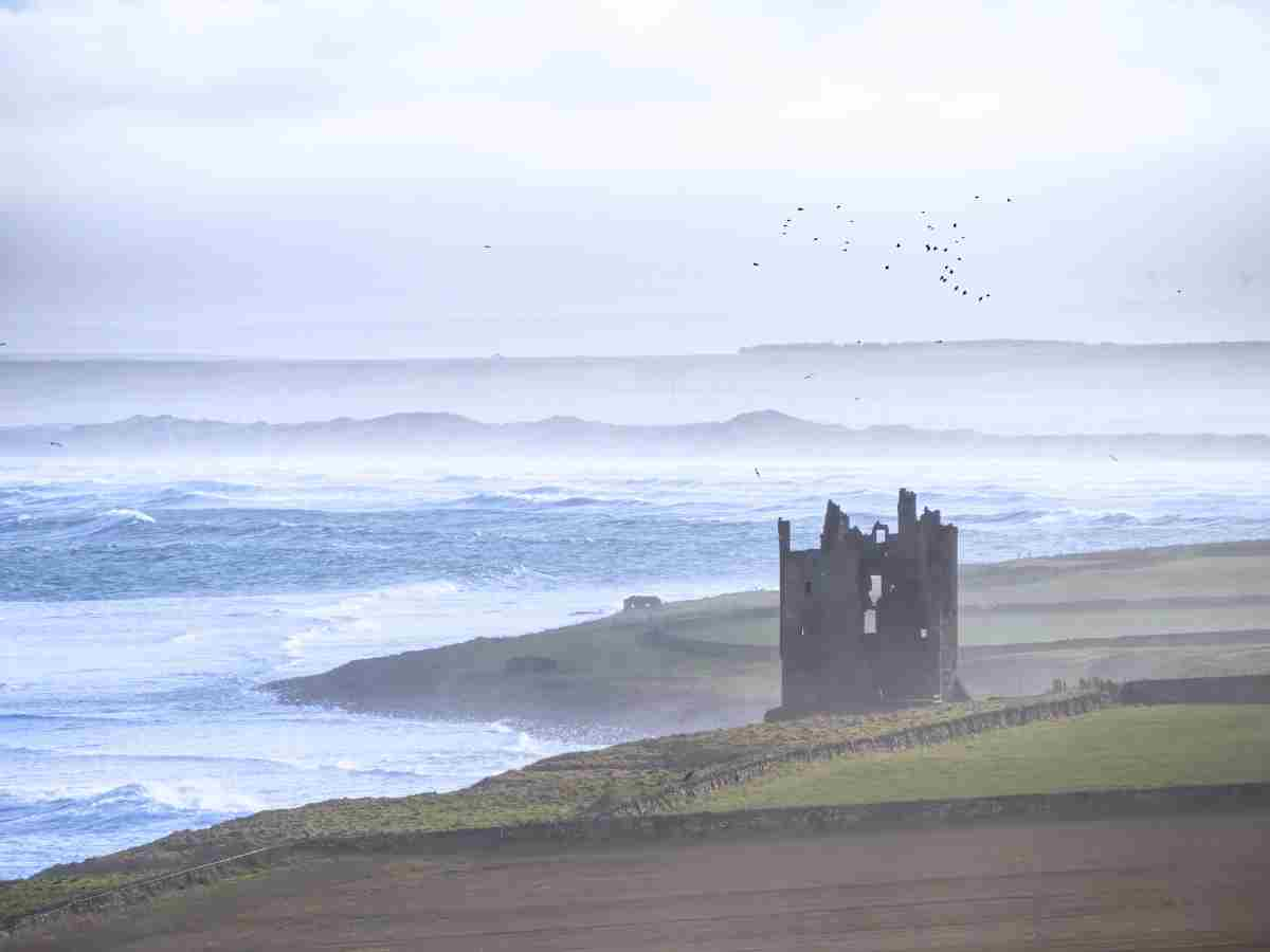 Keiss Castle ruins captured in strong winds and sea mist Timeless Travel Steps