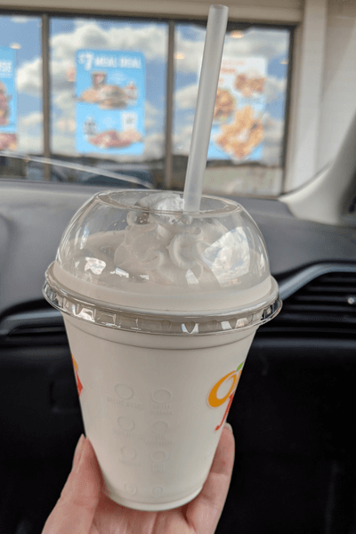 Vanilla milkshake with lots of whipped cream on top