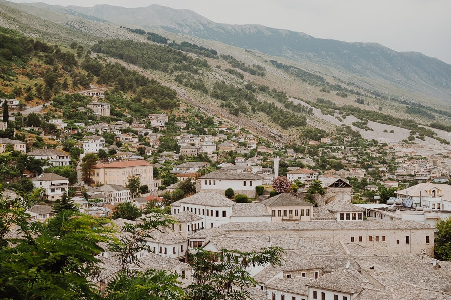 Gjirokaster, a town of white houses and stone roofs in the mountains of Albania.