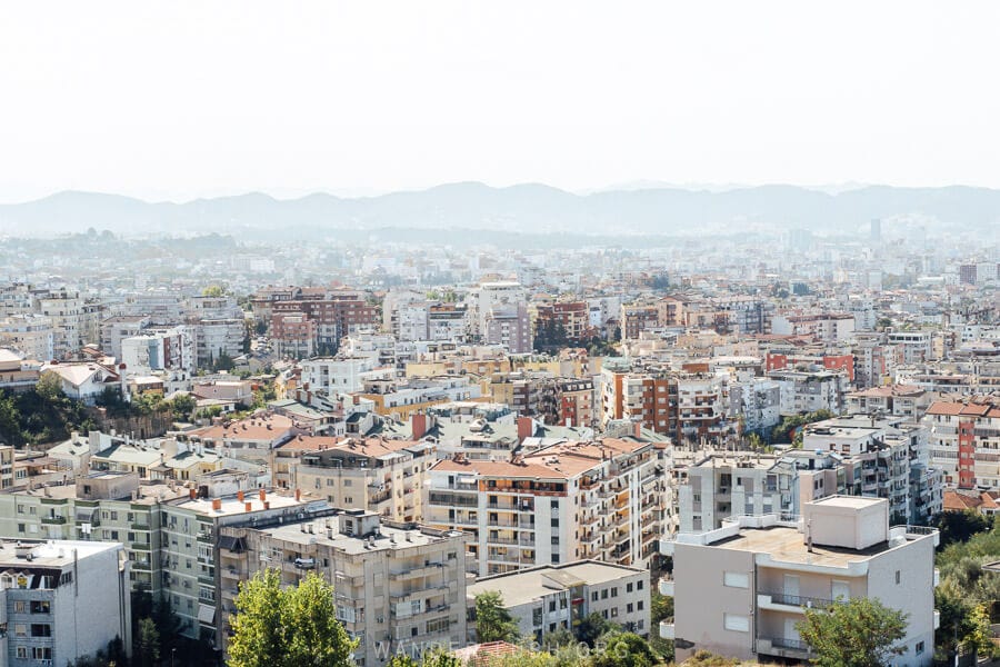 View of Tirana, Albania and its colourful apartments from a rooftop bar.