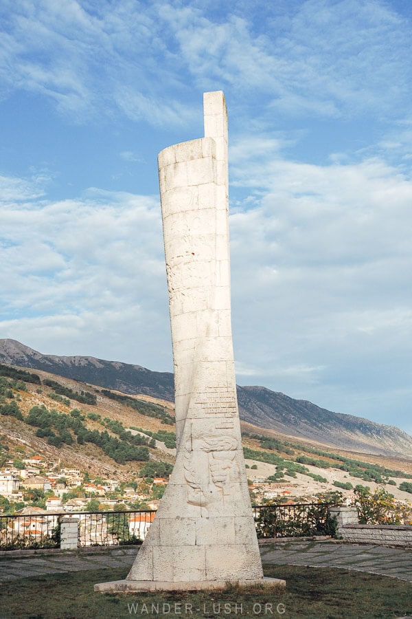 The Gjirokaster Obelisk, a white stone monument above the town in Albania.