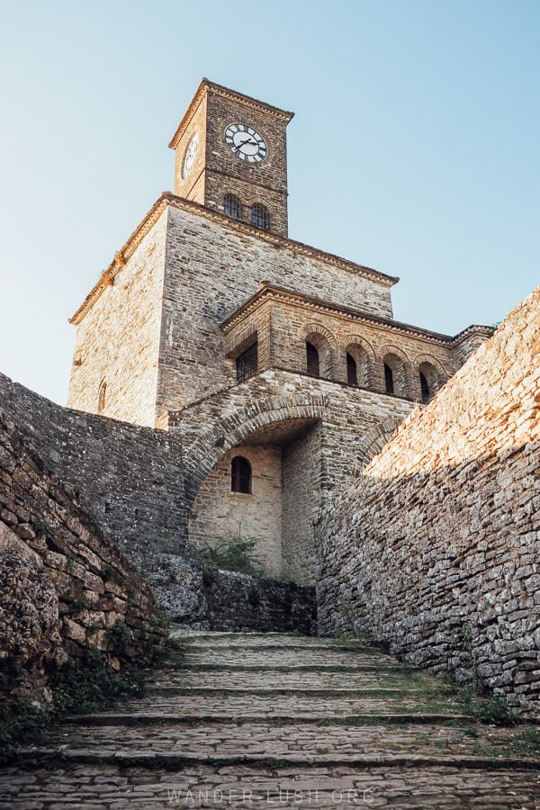 A stone clock tower inside the Castle of Gjirokaster.