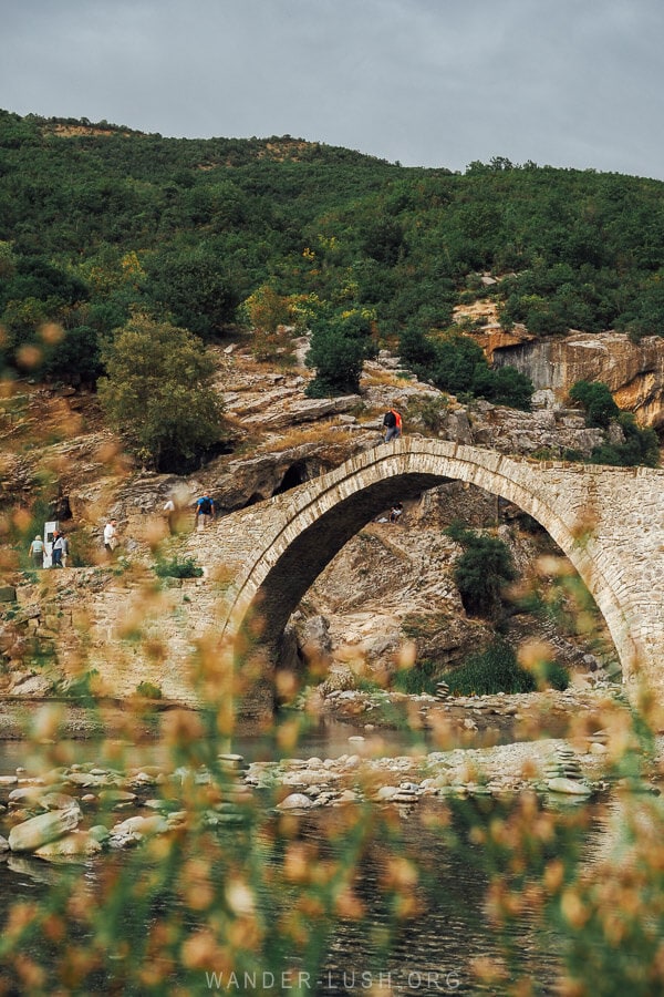 A beautiful Ottoman stone bridge arched over the river in Benja near Permet.