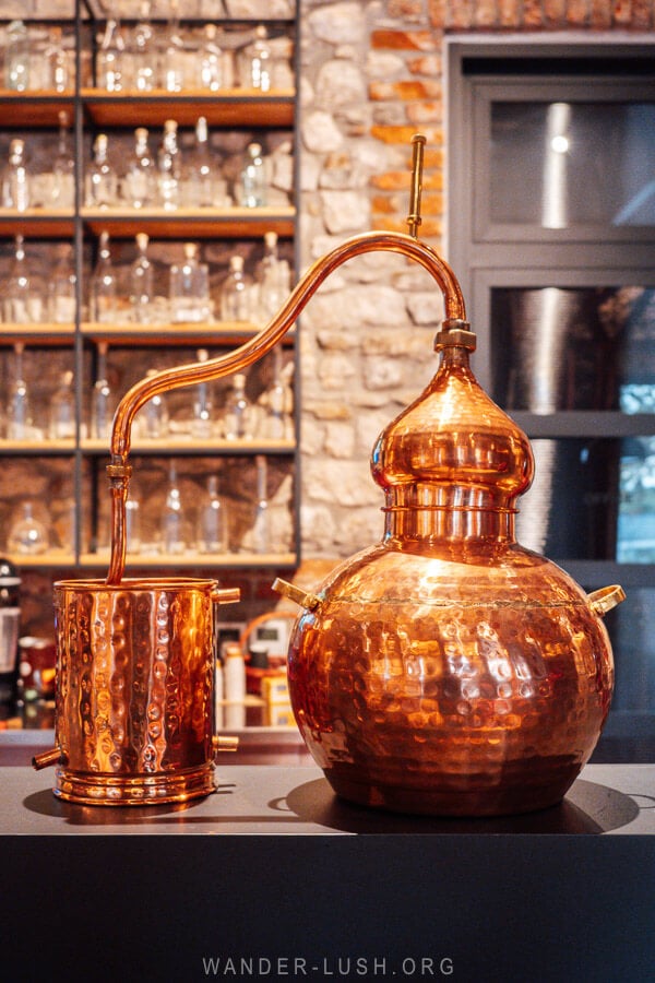 A copper distillery pot on the bar at the Melesin Distillery in Albania.