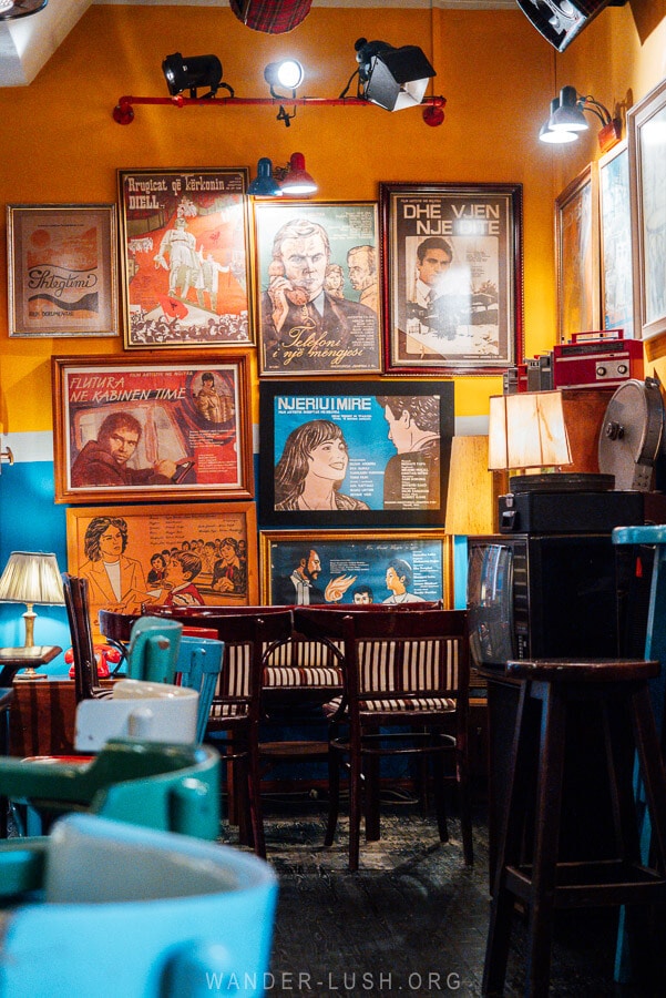 Retro artwork and colourful chairs decorate a trendy bar in the Blloku district of Tirana.