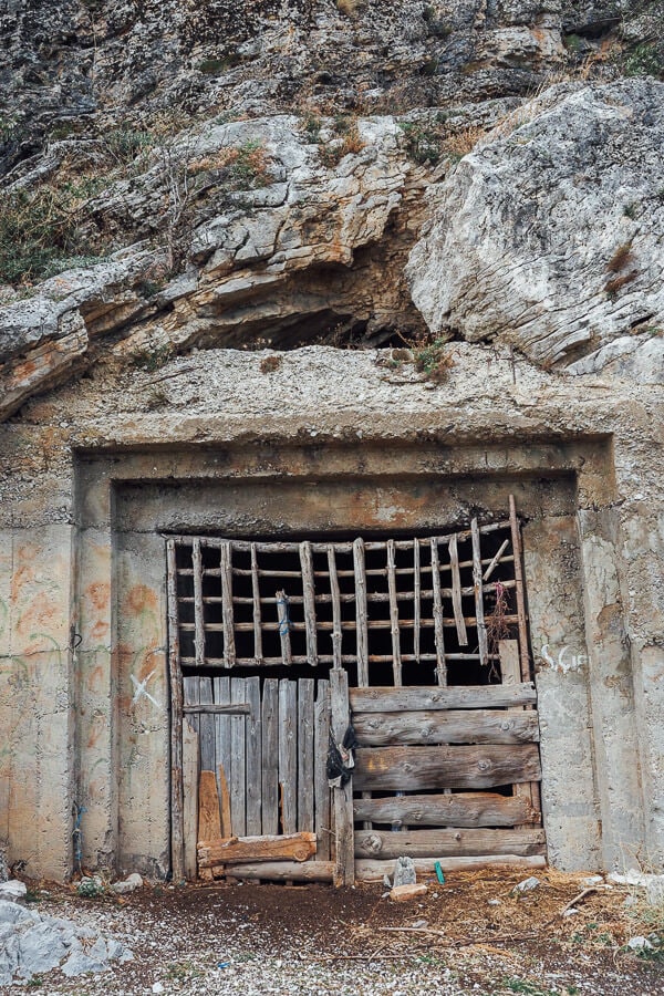 A wooden gate protects the entrance to an old bunker in Leskovik, Albania.