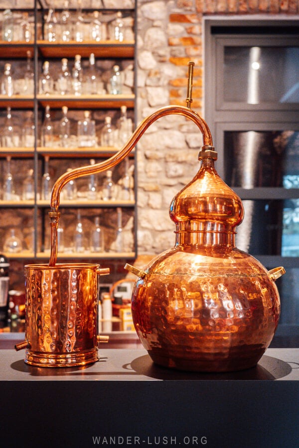 A bronze distillery machine on the counter at the Melesin Distillery in Leskovik.