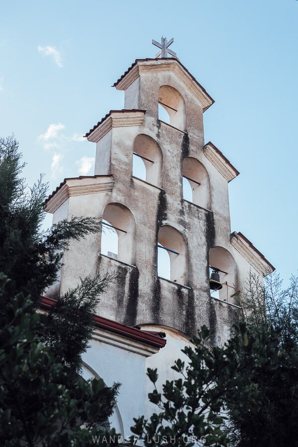 The Greek-style belltower of a church in Lin, Albania.