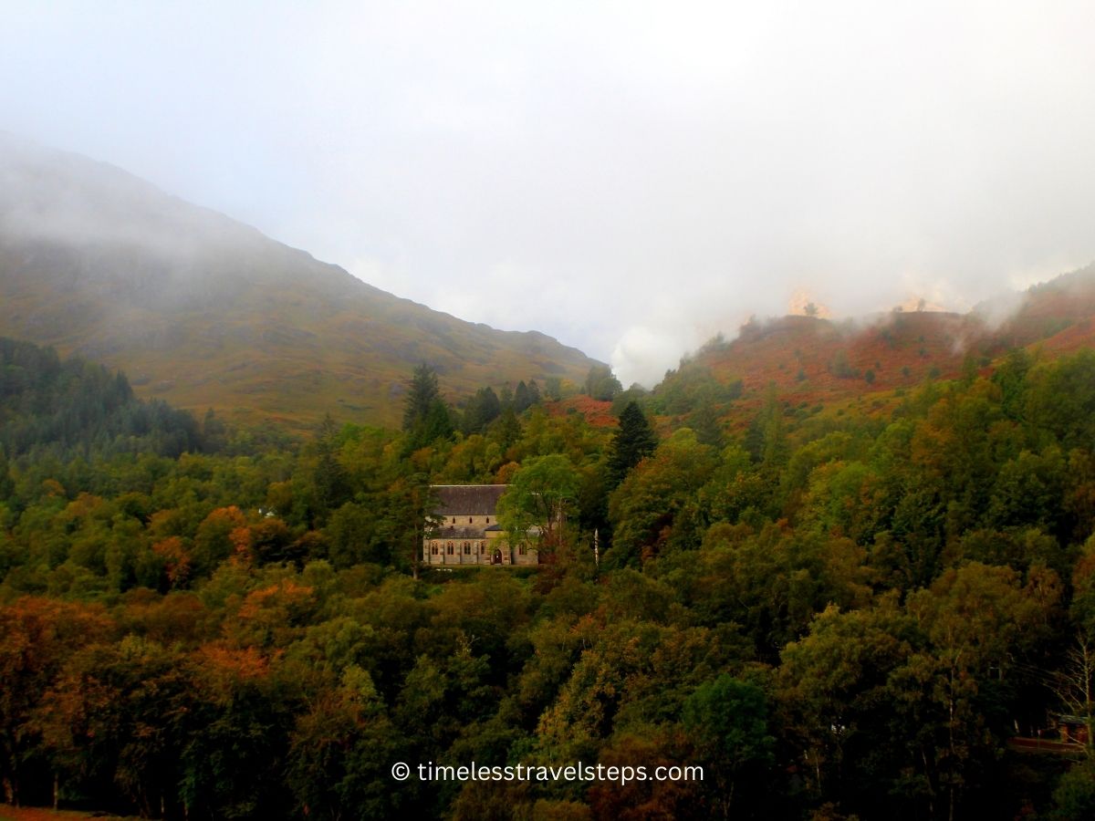 landscape of Glenfinnann during hiking trails - a lone structure in the midst of the mountains on a hazy autumns day