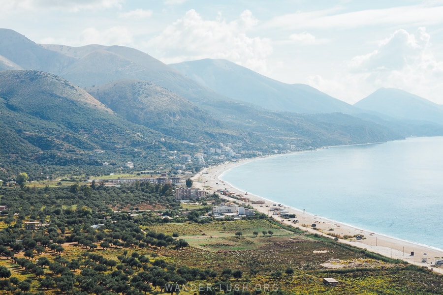 View of Borsh Beach, the longest beach in Albania backed by olive groves and with hotel developments on the shoreline.