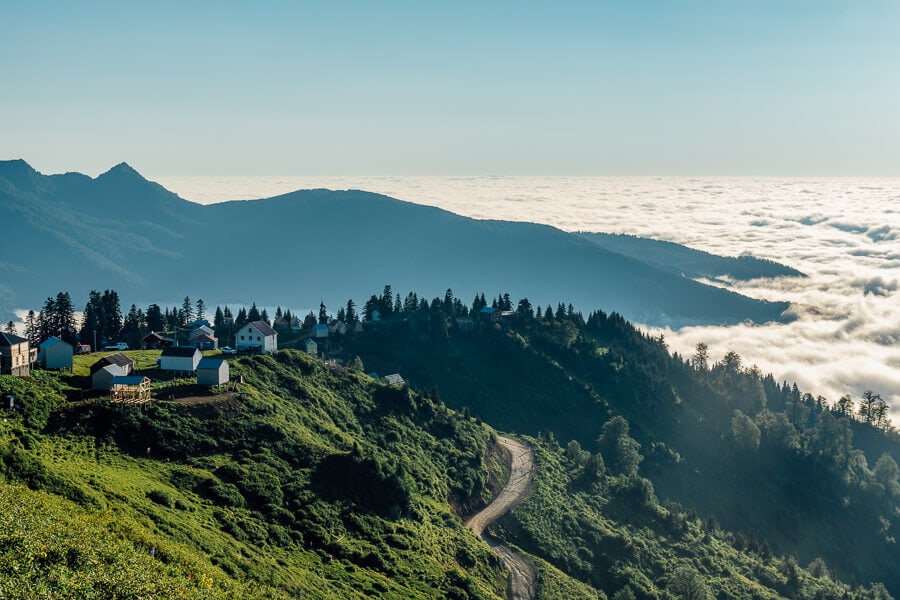 A view of lush forests and clouds from a mountain near Kintrishi Nature Reserve in Georgia.