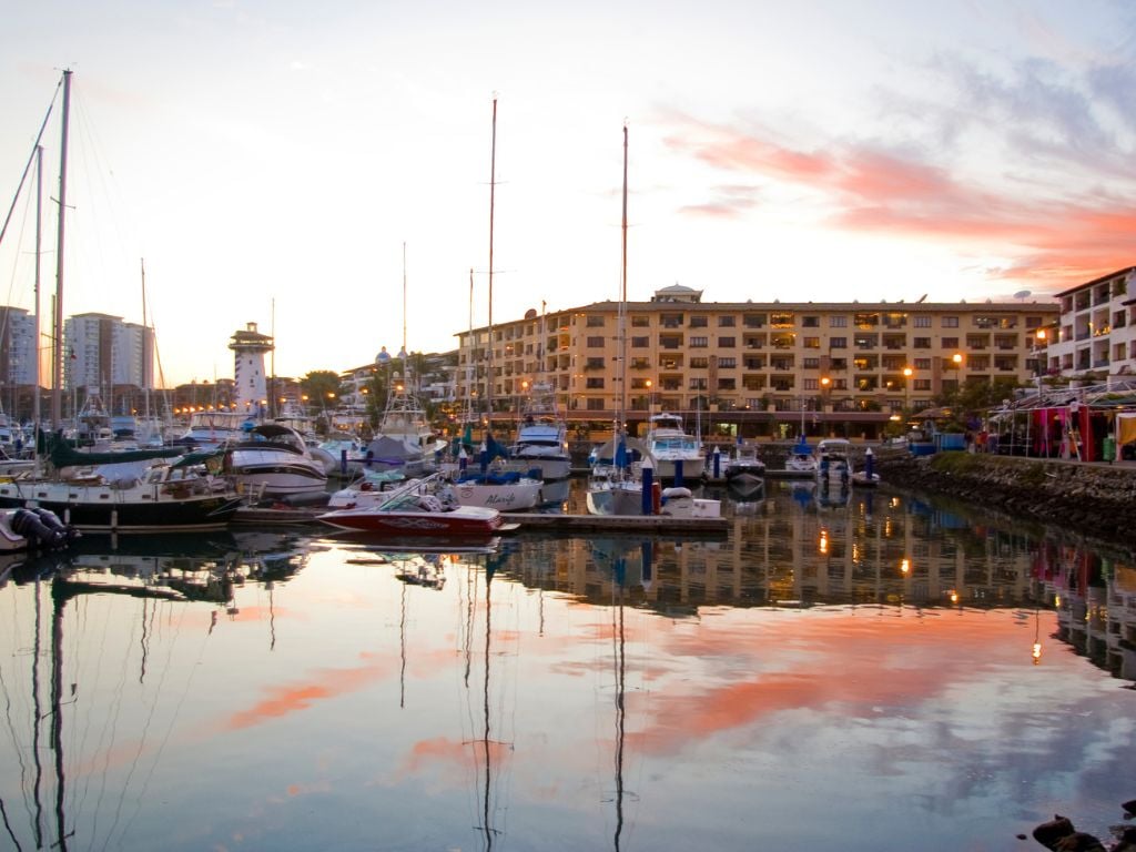 PV marina at sunset with boats and condos