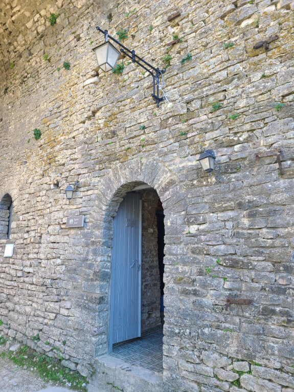 The door in the wall into the free public toilets at Gjirokastra Castle.