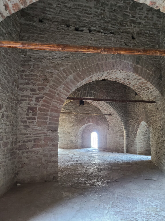 An empty stone room under the clock tower at Gjirokaster castle