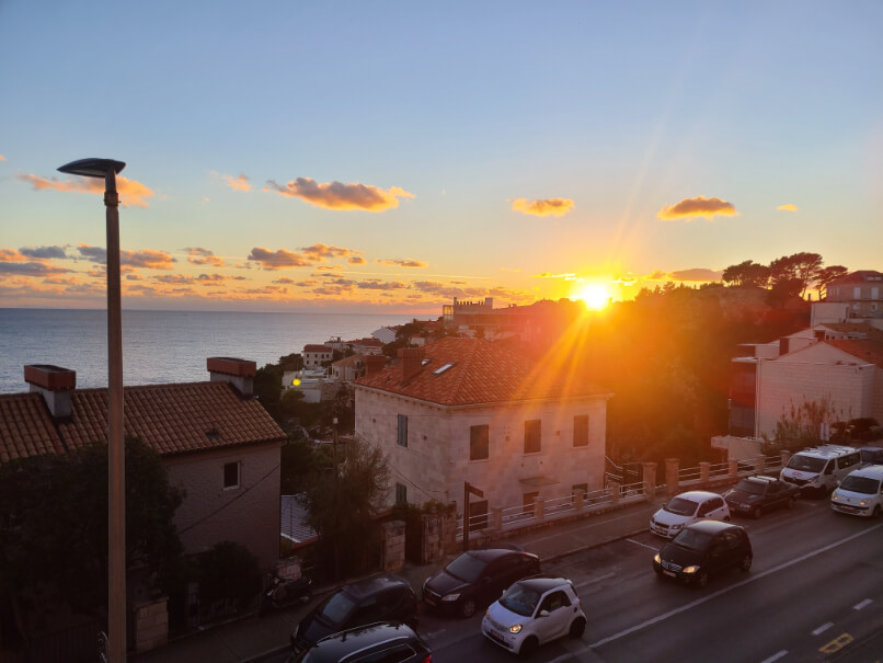 A Winter sunset over the sea and stone houses in upper Dubrovnik near Gruz and Lapad