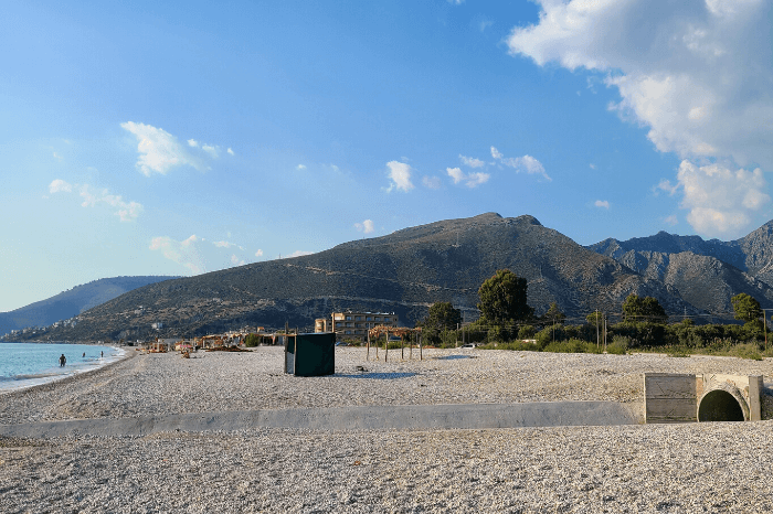 Mountains in the distance behind the long rocky beach at Borsh