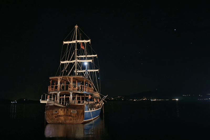 Pirate ship floating peacefully at night