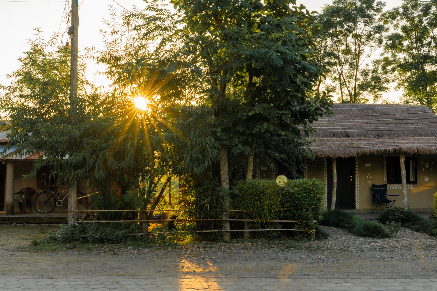 Guesthouse huts in Barauli at sunset.