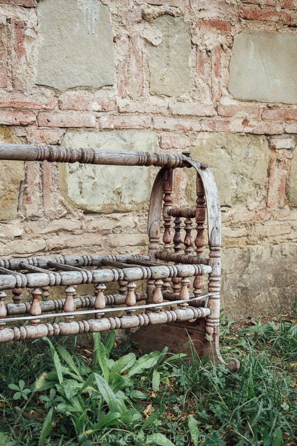 A traditional wooden baby cradle in the yard at Rustavi Church.